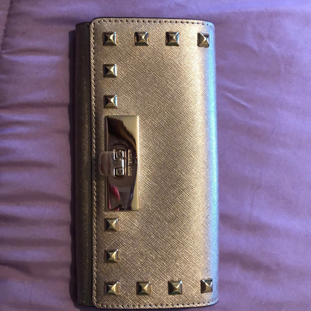 BRAND NEW studded gold mk wallet.